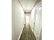 Bright hallway with hardwood floors and neutral walls at 2709 E Troy Ave, Indianapolis, IN 46203