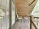 Enjoy the view from this wooden balcony, complete with a chair and table, perfect for relaxing outdoors at 6486 Coyote Dr, Nineveh, IN 46164