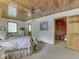 Cozy bedroom featuring a bed, windows and access to other rooms at 6486 Coyote Dr, Nineveh, IN 46164