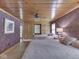 Cozy bedroom with two beds, floral wallpaper, and rustic wood ceiling at 6486 Coyote Dr, Nineveh, IN 46164