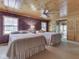 Serene bedroom featuring dual beds, floral wallpaper, and a ceiling fan for added comfort at 6486 Coyote Dr, Nineveh, IN 46164