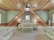 Spacious bedroom with a vaulted wood ceiling, two beds, a bench, lots of natural light, and wood trim at 6486 Coyote Dr, Nineveh, IN 46164