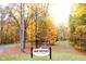 Cordry Sweetwater: a serene, lakeside community embraced by vibrant autumn foliage and nestled in a picturesque landscape at 6486 Coyote Dr, Nineveh, IN 46164