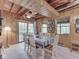 Charming dining room features wood paneling, windows and a dining table for six at 6486 Coyote Dr, Nineveh, IN 46164