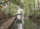 Dock on the lake features canopy and lakeside views surrounded by mature trees at 6486 Coyote Dr, Nineveh, IN 46164