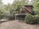 The exterior of this inviting two-story home is accented by a two-car garage and lush surrounding trees at 6486 Coyote Dr, Nineveh, IN 46164
