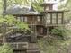 Charming rustic home features a spacious deck with a dining area for outdoor entertaining at 6486 Coyote Dr, Nineveh, IN 46164