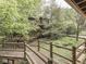Exterior view of a cabin-style home surrounded by lush greenery with wooden walkways at 6486 Coyote Dr, Nineveh, IN 46164