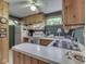 Efficient kitchen with white appliances, wood cabinetry, and a functional layout at 6486 Coyote Dr, Nineveh, IN 46164