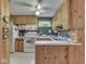Efficient kitchen with white appliances, wood cabinetry and ample counter space at 6486 Coyote Dr, Nineveh, IN 46164