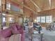 Inviting living room with vaulted ceilings, wood accents, cozy seating, and abundant natural light at 6486 Coyote Dr, Nineveh, IN 46164