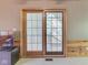 The light-filled living room features a glass sliding door and a decorative wall, adding a touch of style at 6486 Coyote Dr, Nineveh, IN 46164