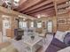 Cozy living space with a fireplace, dining table, comfortable seating, and adjacent kitchen at 6486 Coyote Dr, Nineveh, IN 46164