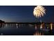 Nighttime view of fireworks over the water, with boats and lights creating a festive atmosphere at 6486 Coyote Dr, Nineveh, IN 46164