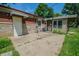 Backyard concrete patio with a white door leading into the house and a separate entrance on the right at 2925 Highwoods Dr, Indianapolis, IN 46222