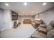 Finished basement with a large television, fireplace, carpet, and comfortable seating great for entertainment at 2925 Highwoods Dr, Indianapolis, IN 46222