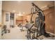 Home gym in basement featuring carpet, various workout machines, and ample space for exercise at 2925 Highwoods Dr, Indianapolis, IN 46222