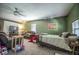 Versatile basement space with a bed, living area and a cozy ambiance at 2925 Highwoods Dr, Indianapolis, IN 46222