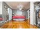 Spacious bedroom with hardwood floors, a ceiling fan, closet, and large window at 2925 Highwoods Dr, Indianapolis, IN 46222