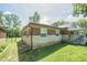 Charming brick home featuring a well-maintained lawn and a covered porch at 2925 Highwoods Dr, Indianapolis, IN 46222