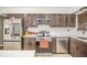 Well-equipped kitchen with stainless steel appliances, granite countertops, and sleek cabinetry at 2925 Highwoods Dr, Indianapolis, IN 46222