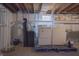 Basement laundry area featuring a washer, dryer, utility sink, and storage space at 2925 Highwoods Dr, Indianapolis, IN 46222