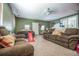 Inviting living room featuring carpet floors, comfortable furniture, and ample natural light perfect for relaxation and Gathering time at 2925 Highwoods Dr, Indianapolis, IN 46222