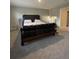 Bedroom with plush carpeting and a large bed and doorway to another room at 7108 Parkstay Ct, Indianapolis, IN 46113