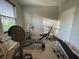 Home gym with weightlifting equipment and natural light from the window at 7108 Parkstay Ct, Indianapolis, IN 46113