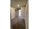 Hallway features neutral walls, plush carpeting, and white doors to other rooms at 7108 Parkstay Ct, Indianapolis, IN 46113