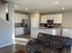 Bright kitchen features an island, stainless steel appliances and white cabinets at 7108 Parkstay Ct, Indianapolis, IN 46113