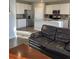 Open concept kitchen with stainless steel appliances, island, and granite countertops at 7108 Parkstay Ct, Indianapolis, IN 46113