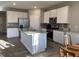 Contemporary kitchen with stainless steel appliances, island, and ample cabinet space at 7108 Parkstay Ct, Indianapolis, IN 46113