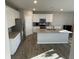 Modern kitchen featuring stainless steel appliances, island, and tiled backsplash at 7108 Parkstay Ct, Indianapolis, IN 46113