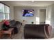 Spacious living room featuring wood laminate floors, two couches, and natural light at 7108 Parkstay Ct, Indianapolis, IN 46113