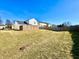 Vast backyard partially enclosed with wood and modern fence at 12359 Deerview Dr, Noblesville, IN 46060