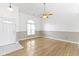 Bright living room featuring hardwood floors and ceiling fan at 20642 Summit Rd, Noblesville, IN 46062