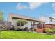 Well-maintained back yard boasts a wood deck, lush lawn, and mature trees, perfect for outdoor enjoyment at 778 Kingston Cir, Brownsburg, IN 46112
