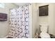 A well-maintained bathroom featuring a shower-tub with a patterned curtain at 778 Kingston Cir, Brownsburg, IN 46112