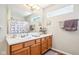 Bathroom featuring a double vanity, bright lighting, and modern fixtures at 778 Kingston Cir, Brownsburg, IN 46112