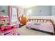 Bright bedroom featuring a charming princess themed bed, dresser, and ample natural light at 778 Kingston Cir, Brownsburg, IN 46112