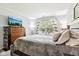 Bedroom with TV, dresser and window with natural light and calming color palette at 778 Kingston Cir, Brownsburg, IN 46112
