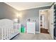 Spacious Bedroom with grey walls, white crib, and dresser at 778 Kingston Cir, Brownsburg, IN 46112