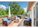 Inviting outdoor deck with comfortable seating, a grill, and a view of the lush backyard at 778 Kingston Cir, Brownsburg, IN 46112