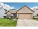 Charming brick home features a two-car garage, manicured lawn, and a welcoming entrance at 778 Kingston Cir, Brownsburg, IN 46112