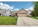 Charming brick home features a two-car garage, manicured lawn, and a welcoming entrance at 778 Kingston Cir, Brownsburg, IN 46112