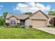 Charming brick home features a two-car garage, manicured lawn, and a welcoming entrance at 778 Kingston Cir, Brownsburg, IN 46112