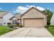 Charming brick home features a two-car garage, manicured lawn, and a welcoming entrance at 778 Kingston Cir, Brownsburg, IN 46112