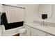 Modern bathroom featuring a shower-tub combo, stylish vanity and an oval mirror at 527 E North St, Indianapolis, IN 46204