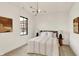 Bedroom featuring neutral tones, a modern light fixture, and views of the neighborhood at 527 E North St, Indianapolis, IN 46204